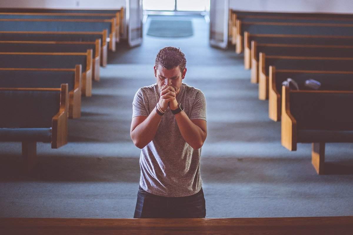 man - church - praying