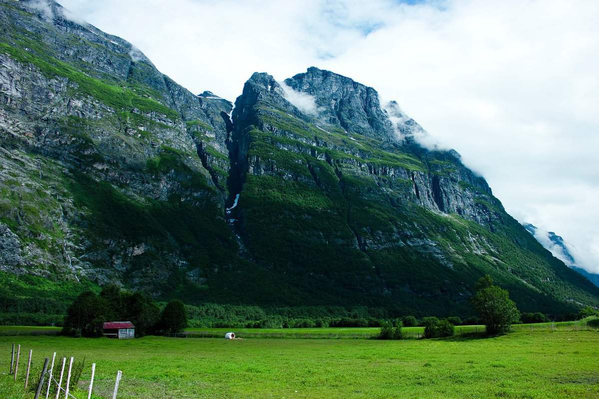 clouds-mountains-meadow