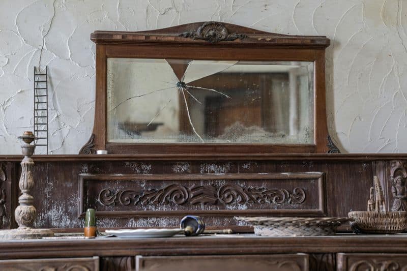 Broken Mirrors Reflecting Negative Vibes